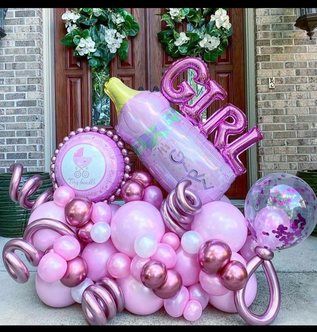 Pink balloon bouquet celebrating a baby girl