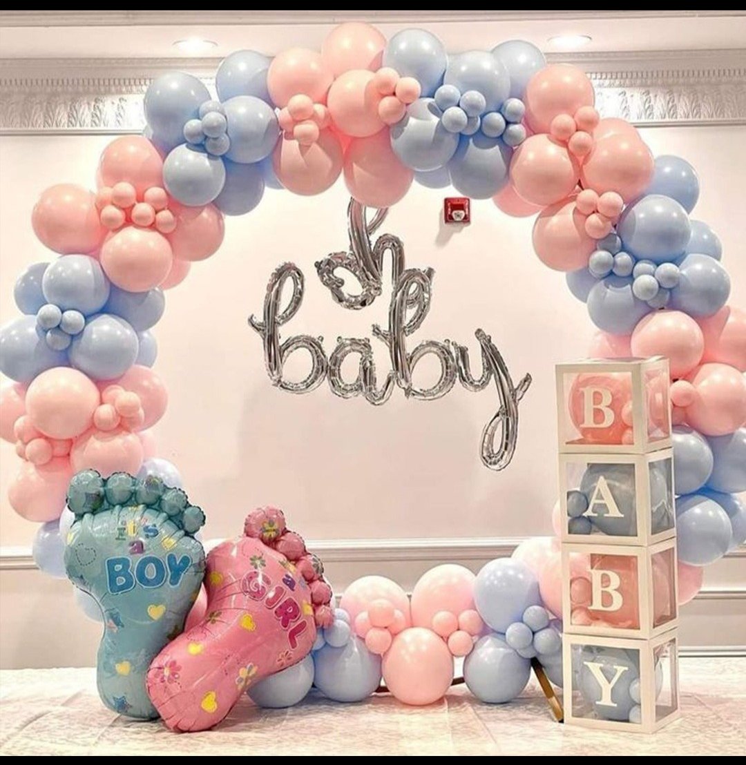 Pastel pink and blue baby shower balloon arch