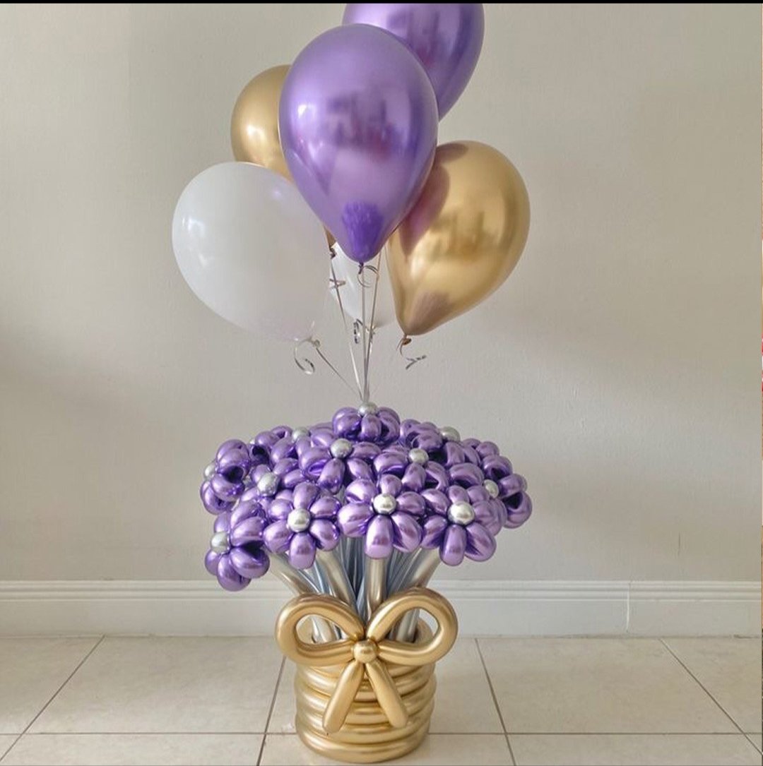 Purple and gold helium balloon bouquet arrangement