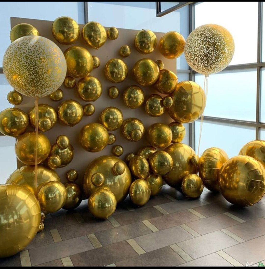 Gold orb balloon wall