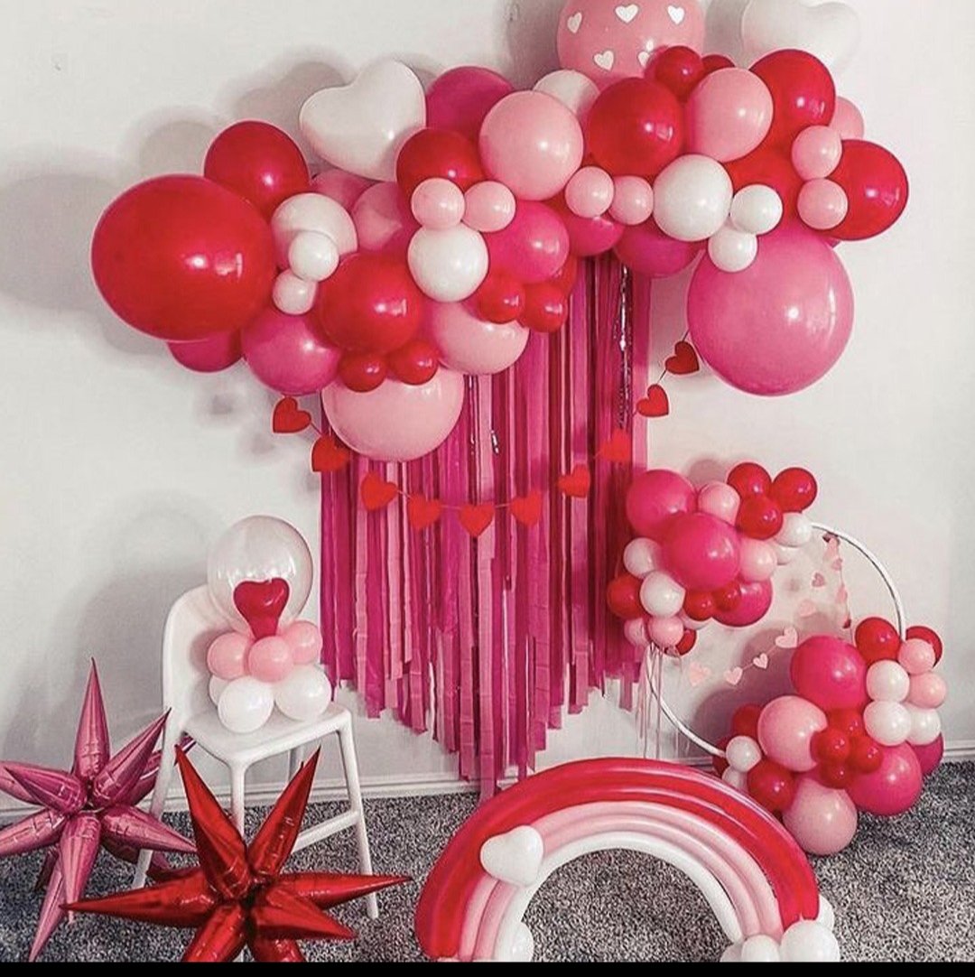 Red and pink heart balloon installation