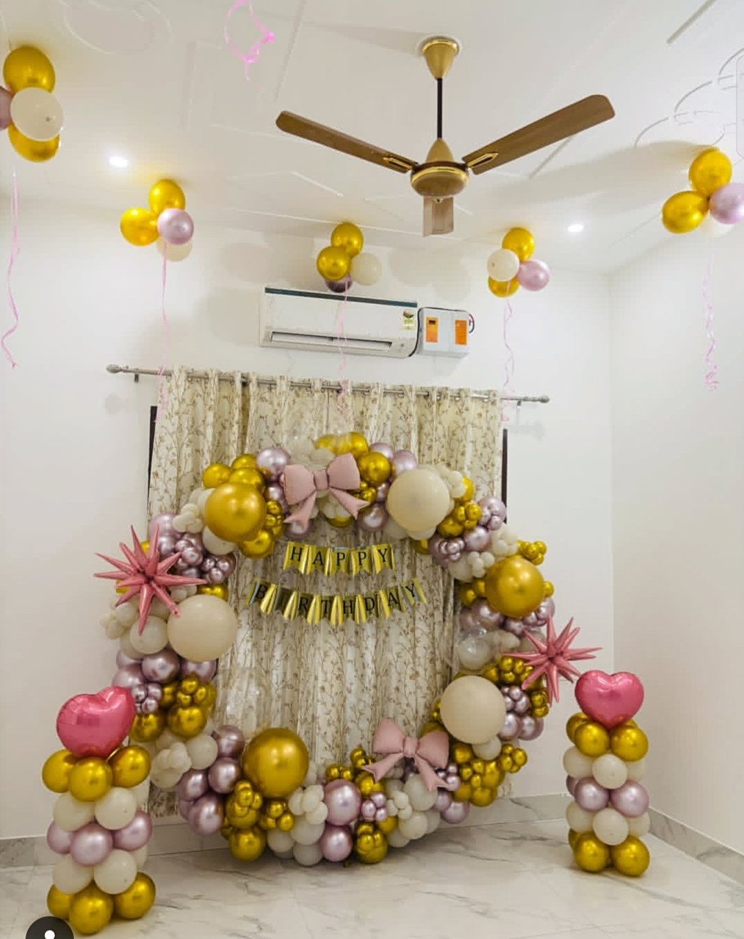 Gold and pink room decoration with balloon ring